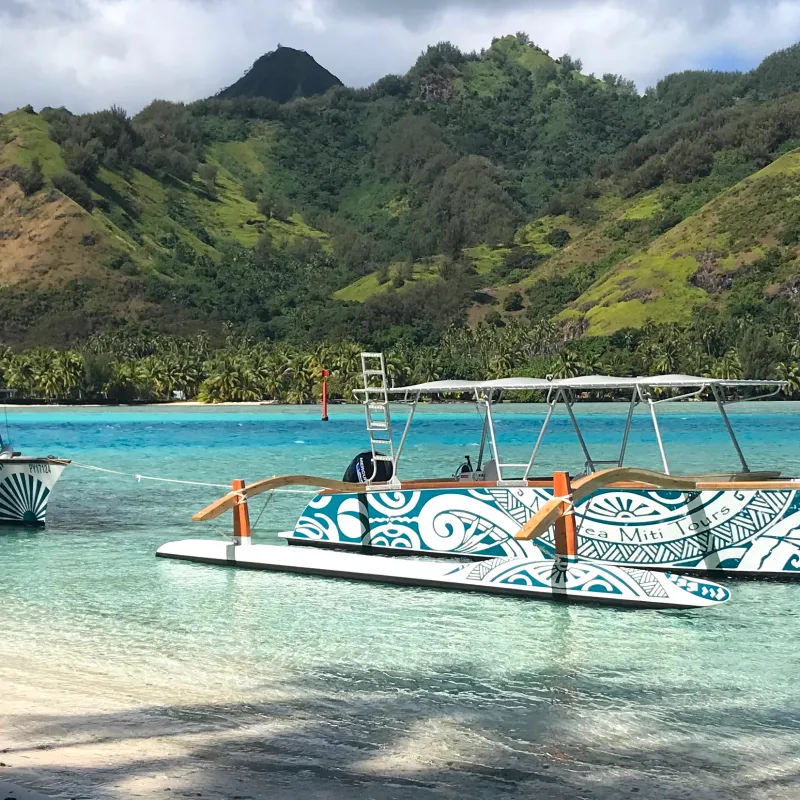a boat is docked next to a body of water