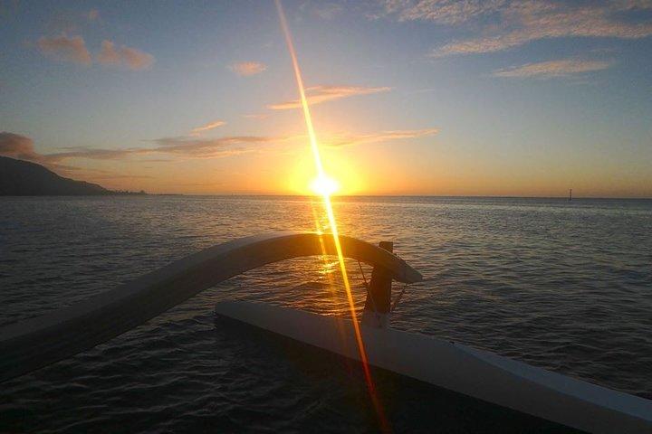 a sunset over a body of water